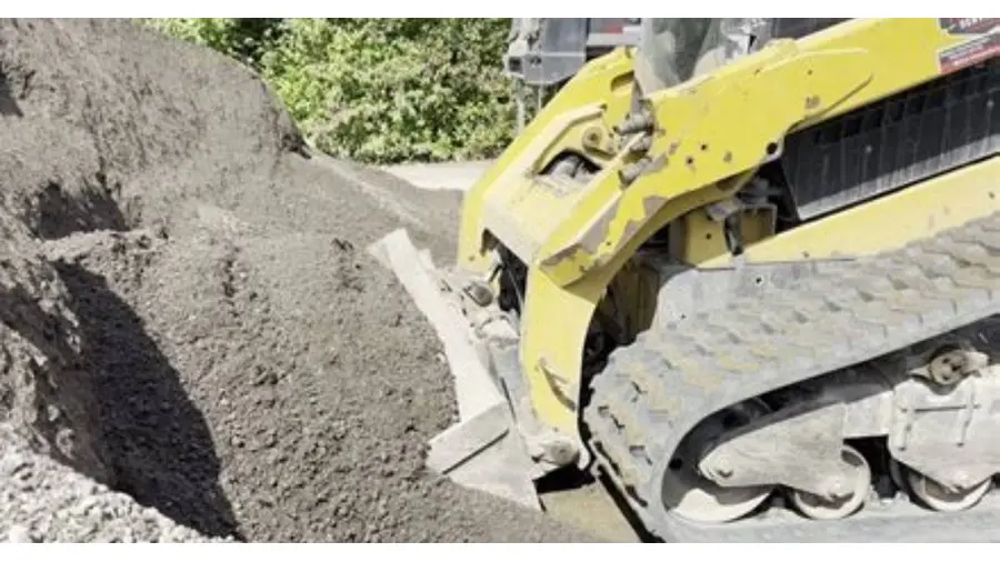 site:pexels.com skid steer loader moving soil construction